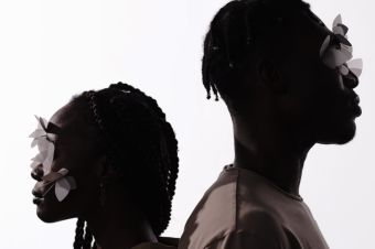 Man and Woman with White Butterflies on Their Faces